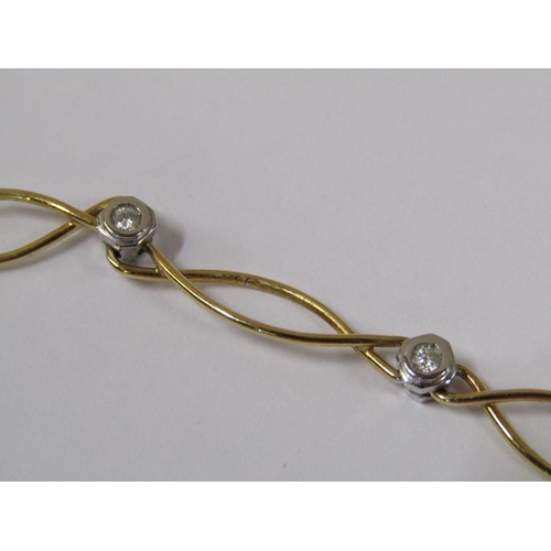 1615 - An 18ct yellow and white gold necklet, diamond set together with a pair of matching earrings.