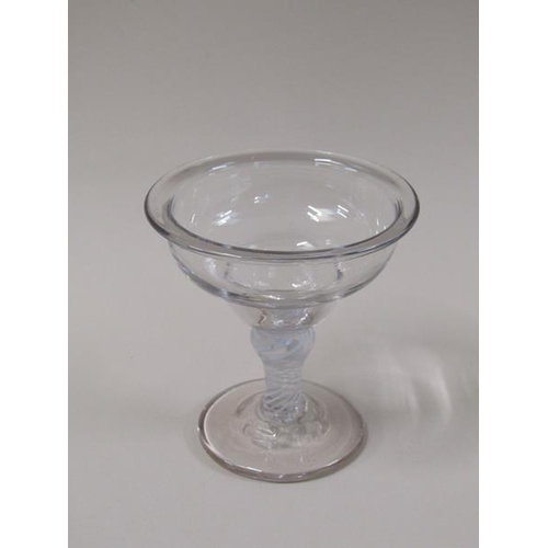 1865 - A mid 18c sweetmeat glass with a lipped double ogee bowl on opaque twist stem with shoulder knop on ... 