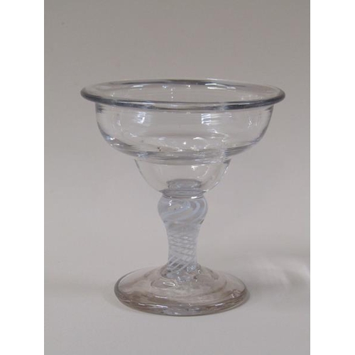 1865 - A mid 18c sweetmeat glass with a lipped double ogee bowl on opaque twist stem with shoulder knop on ... 