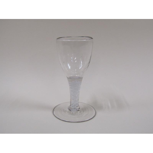 1870 - A mid 18c wine glass with a round funnel bowl on a double series opaque twist stem with a slightly d... 