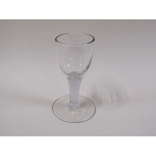 1870 - A mid 18c wine glass with a round funnel bowl on a double series opaque twist stem with a slightly d... 