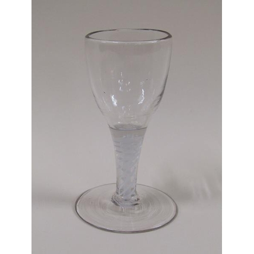 1870 - A mid 18c wine glass with a round funnel bowl on a double series opaque twist stem with a slightly d... 