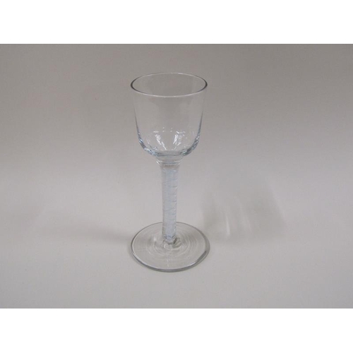 1871 - A mid 18c wine glass with an ogee bowl, a double series opaque twist stem on a slightly dome foot (f... 