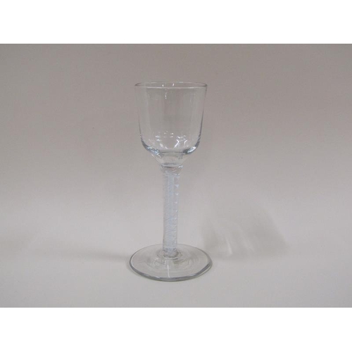 1871 - A mid 18c wine glass with an ogee bowl, a double series opaque twist stem on a slightly dome foot (f... 