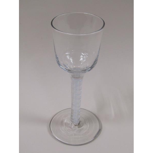 1871 - A mid 18c wine glass with an ogee bowl, a double series opaque twist stem on a slightly dome foot (f... 