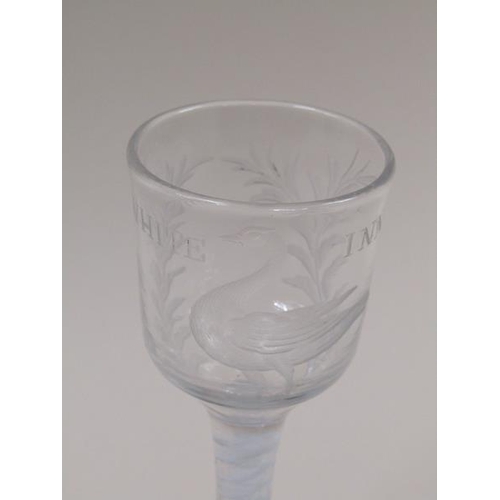 1872 - A mid 18c wine glass, the ogee bowl with an engraved border of a swan in water amongst leafy sprays ... 