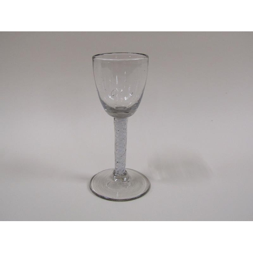 1873 - A mid 18c wine glass with an ogee bowl and a double series opaque twist stem on a slightly dome foot... 