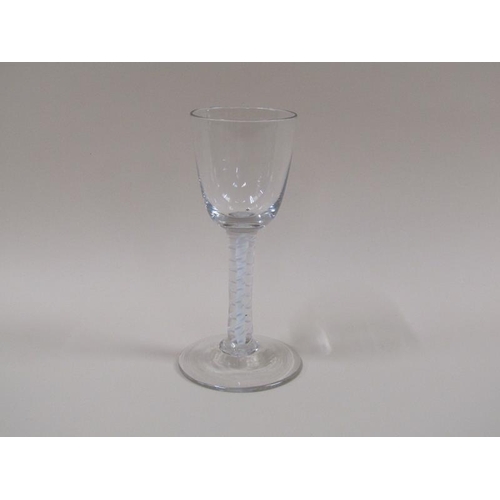 1875 - A mid 18c wine glass with a round funnel bowl on a double series opaque twist outside a single tape ... 