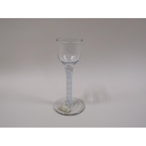 1880 - A mid 18c wine glass with a round funnel bowl on a twelve ply spiral band outside a pair of spiral t... 