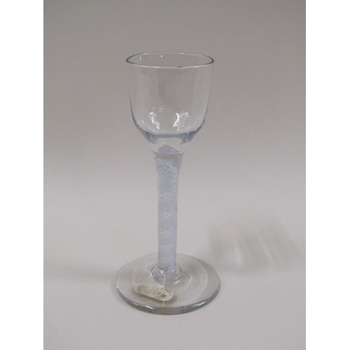 1880 - A mid 18c wine glass with a round funnel bowl on a twelve ply spiral band outside a pair of spiral t... 