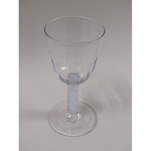 1881 - An 18c Ale glass with a half facet round funnel bowl on a double series opaque twist stem with a dom... 