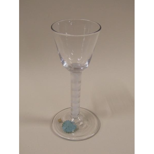 1882 - A mid 18c wine glass with a round funnel bowl on a double series opaque twist stem with a spiral tap... 