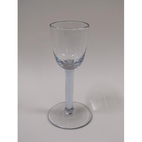 1883 - An 18c wine glass with a round funnel bowl on double series opaque twist stem - pair of spiral tapes... 