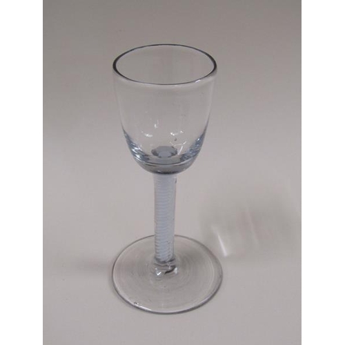 1883 - An 18c wine glass with a round funnel bowl on double series opaque twist stem - pair of spiral tapes... 