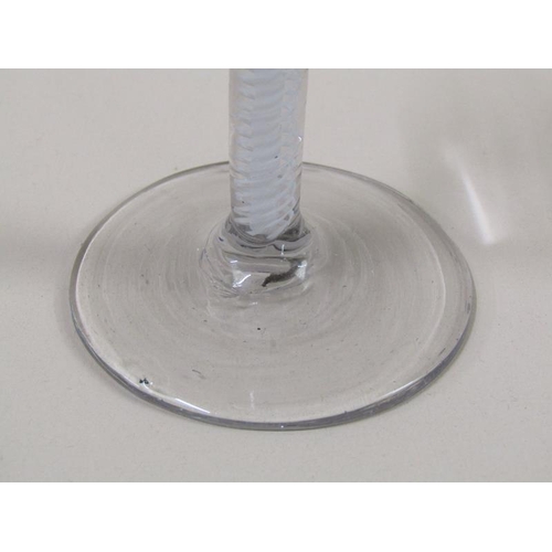 1883 - An 18c wine glass with a round funnel bowl on double series opaque twist stem - pair of spiral tapes... 