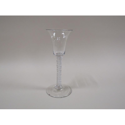 1884 - An 18c wine glass with a bell shaped bowl on a double series air twist stem with a domed foot, 16cm ... 