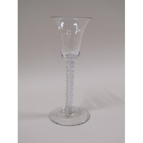 1884 - An 18c wine glass with a bell shaped bowl on a double series air twist stem with a domed foot, 16cm ... 