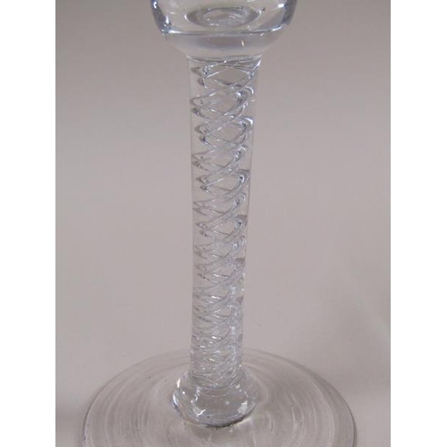 1884 - An 18c wine glass with a bell shaped bowl on a double series air twist stem with a domed foot, 16cm ... 