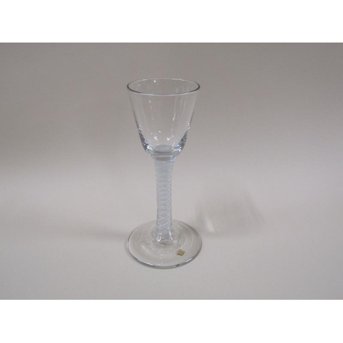 1885 - An 18c wine glass with a round funnel bowl and a double series opaque white twist stem on a domed ci... 