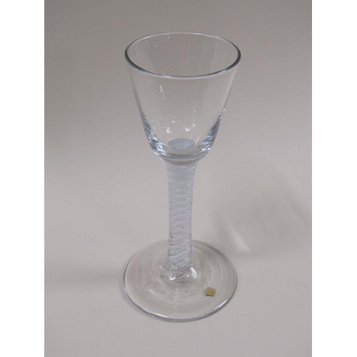 1885 - An 18c wine glass with a round funnel bowl and a double series opaque white twist stem on a domed ci... 