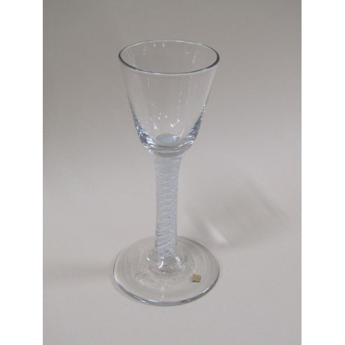 1885 - An 18c wine glass with a round funnel bowl and a double series opaque white twist stem on a domed ci... 