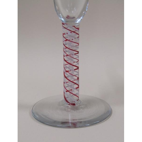 1886 - A late 18c/early 19c  wine glass with bell shaped bowl on a red and opaque white triple series stem ... 