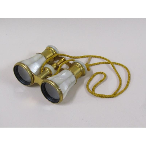 1483 - A pair of brass and mother of pearl opera glasses by Lemaire of Paris, with velvet pouch.