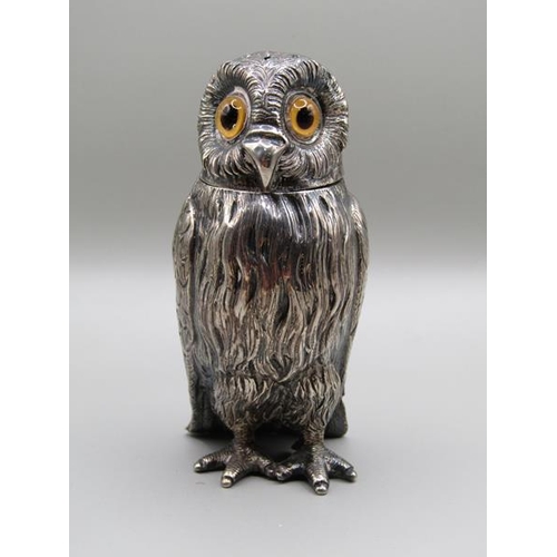 1535 - A mid Victorian silver owl pepper pot with glass eyes, makers mark for Daniel & Charles Hurle, Londo... 