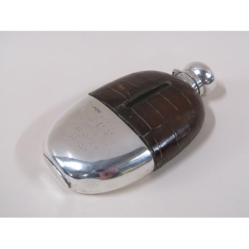 1731 - A late Victorian silver mounted pocket flask with leather shoulders, having a hinged screw top, Shef... 