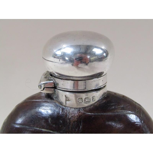 1731 - A late Victorian silver mounted pocket flask with leather shoulders, having a hinged screw top, Shef... 