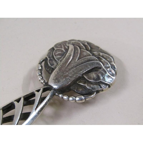 1733 - An early 20c Georg Jensen silver spoon with decorative handle and terminal, c.1925, 2.3ozt, 18.5cm l... 