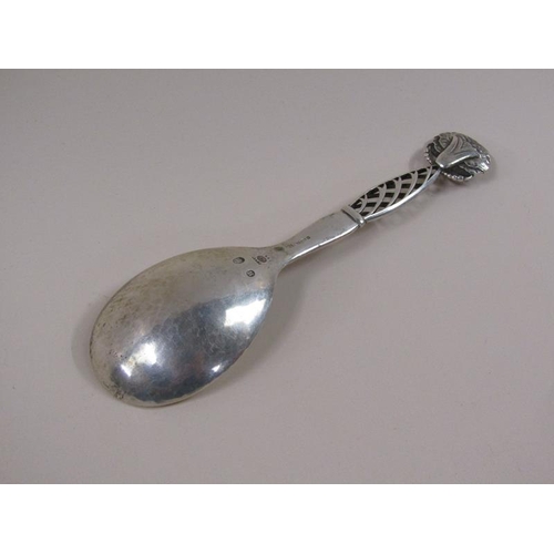 1733 - An early 20c Georg Jensen silver spoon with decorative handle and terminal, c.1925, 2.3ozt, 18.5cm l... 