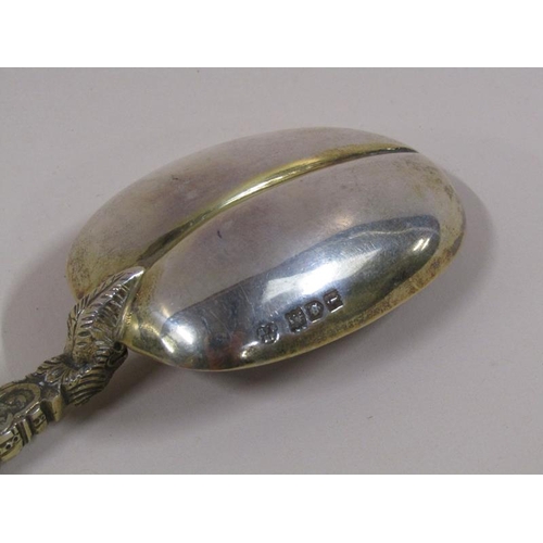 1734 - An Edwardian silver gilt anointing spoon, London 1904, 3ozt, 25.5cm l.