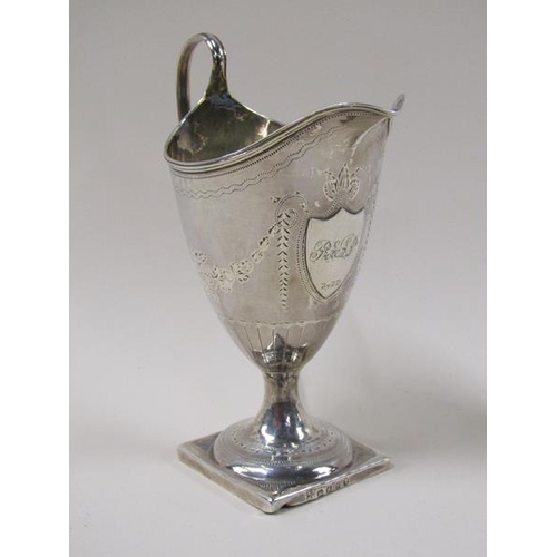 1736 - A late Georgian silver cream jug, engraved and supported on square base, 2.9ozt, London 1813, 14.5cm... 