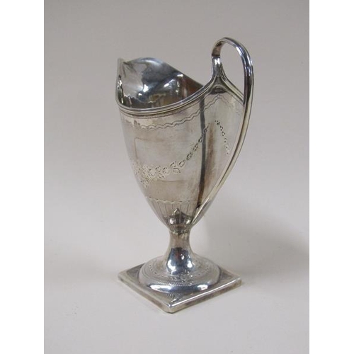 1736 - A late Georgian silver cream jug, engraved and supported on square base, 2.9ozt, London 1813, 14.5cm... 