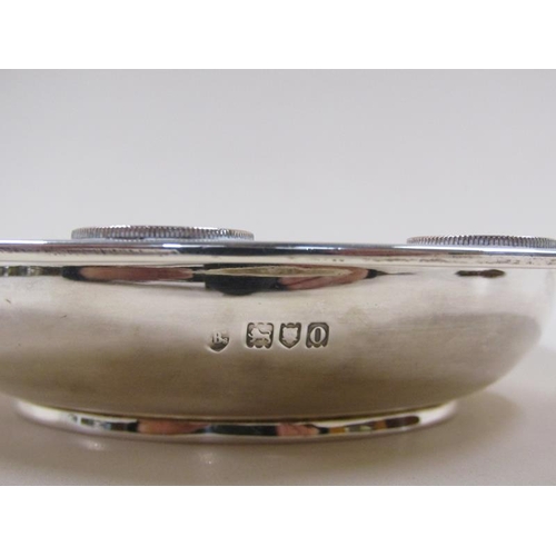 1740 - An early 20c silver dish with coin border decoration, London 1909, 10ozt, 18.5cm diam.