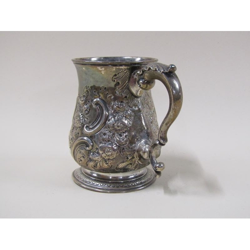 1743 - A George II silver half pint baluster tankard with later leaf, scroll and flower embossing, with dou... 