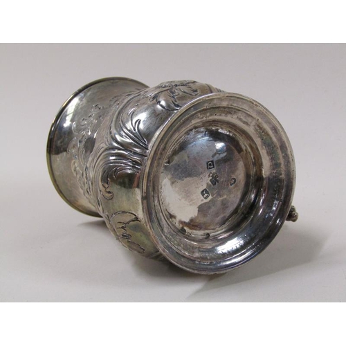 1743 - A George II silver half pint baluster tankard with later leaf, scroll and flower embossing, with dou... 