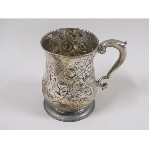 1747 - A George III baluster tankard with later embossed and chased floral and scroll decoration, with doub... 