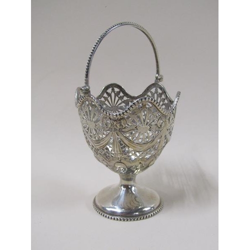 1750 - A late Victorian silver bonbon basket with a pierced swag decorated bowl, having a beaded swing hand... 