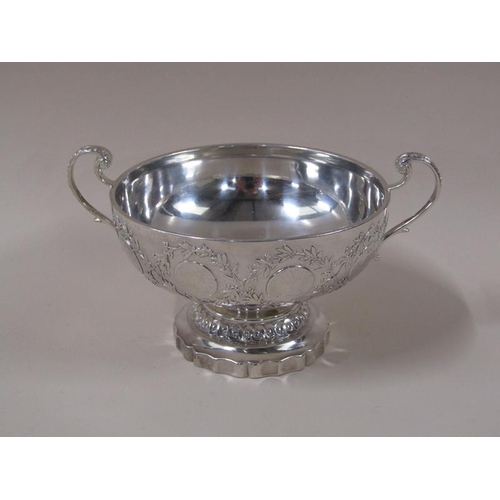 1756 - A Continental silver two handled bowl on stand with coin border decoration, heart terminals to the h... 