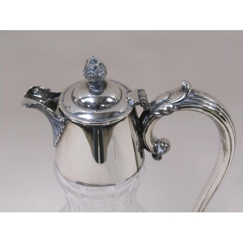 1808 - An Edwardian cut glass baluster claret jug with silver plated mount and having scrolling handle, 31c... 