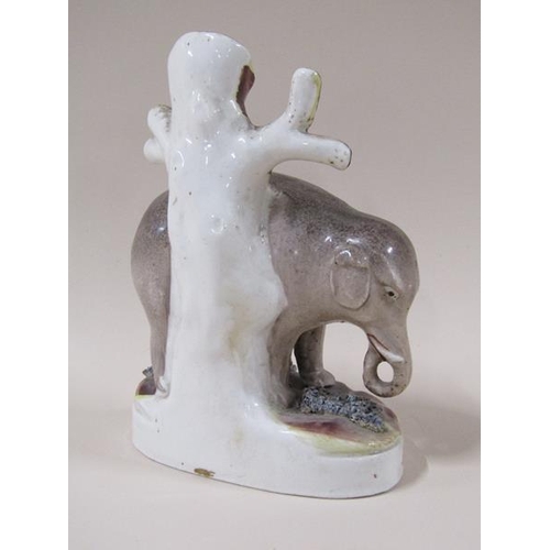 1960 - A 19c Victorian Staffordshire elephant spill vase, 17cm h.