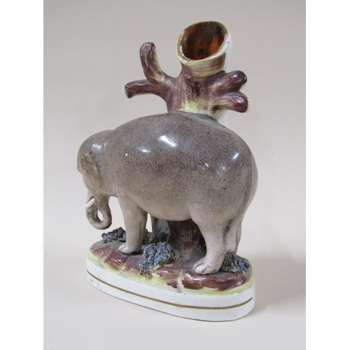 1960 - A 19c Victorian Staffordshire elephant spill vase, 17cm h.