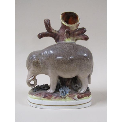 1960 - A 19c Victorian Staffordshire elephant spill vase, 17cm h.