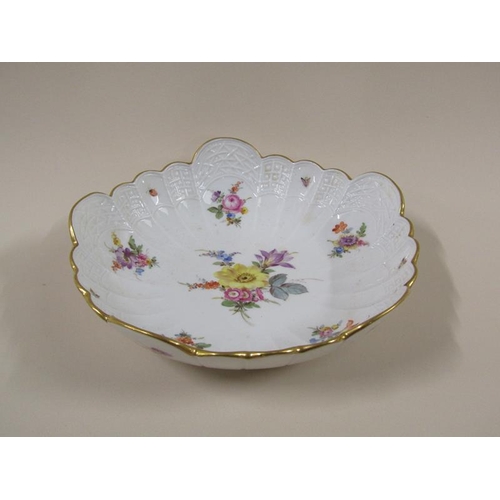 1961 - A Meissen scalloped porcelain bowl, hand painted with floral sprays and insects within a moulded bor... 