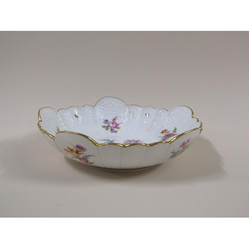 1961 - A Meissen scalloped porcelain bowl, hand painted with floral sprays and insects within a moulded bor... 