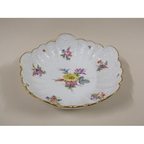 1961 - A Meissen scalloped porcelain bowl, hand painted with floral sprays and insects within a moulded bor... 