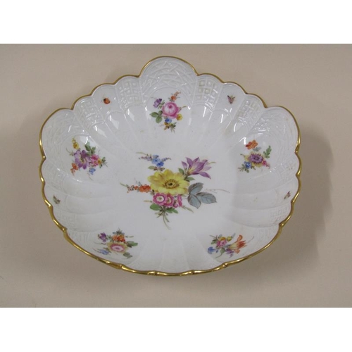 1961 - A Meissen scalloped porcelain bowl, hand painted with floral sprays and insects within a moulded bor... 