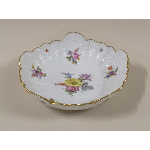 1961 - A Meissen scalloped porcelain bowl, hand painted with floral sprays and insects within a moulded bor... 